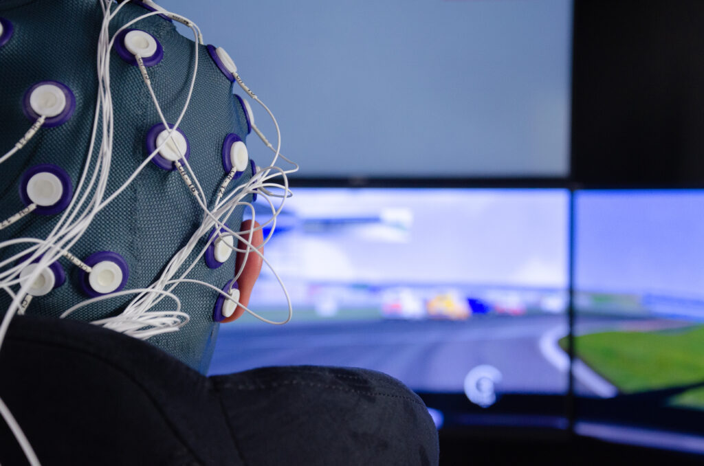 The study setup for Assessing Cognitive Load in Autonomous Driving included wearing an EEG Cap.